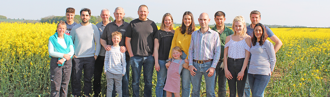 The team at Breckenholme standing in a rapeseed field