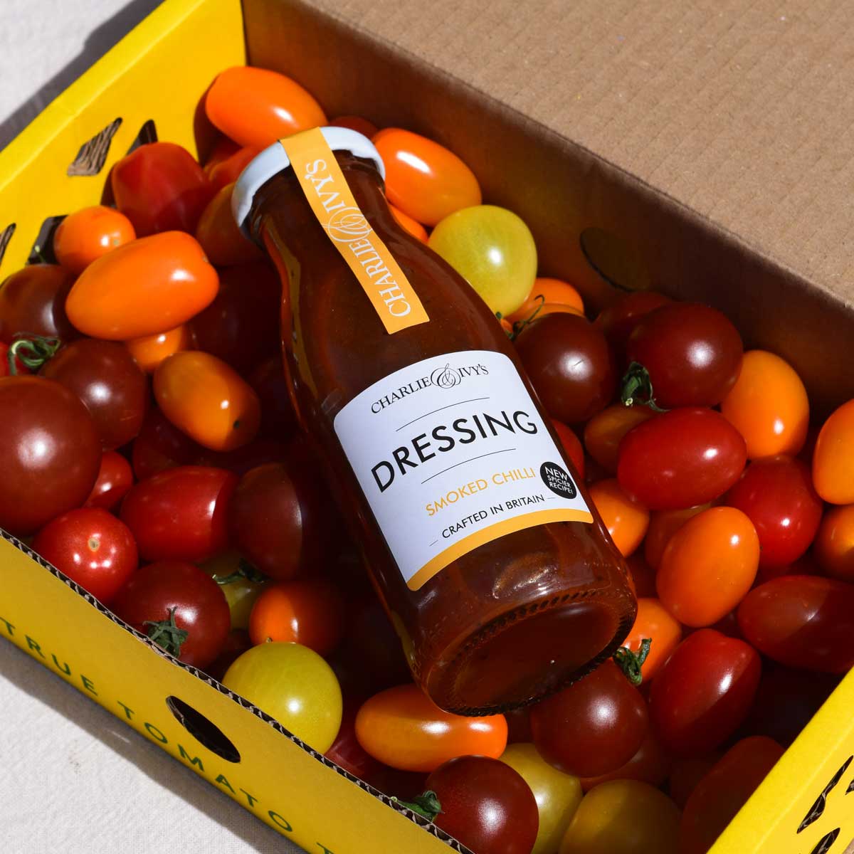 Dressing bottle in box of tomatoes