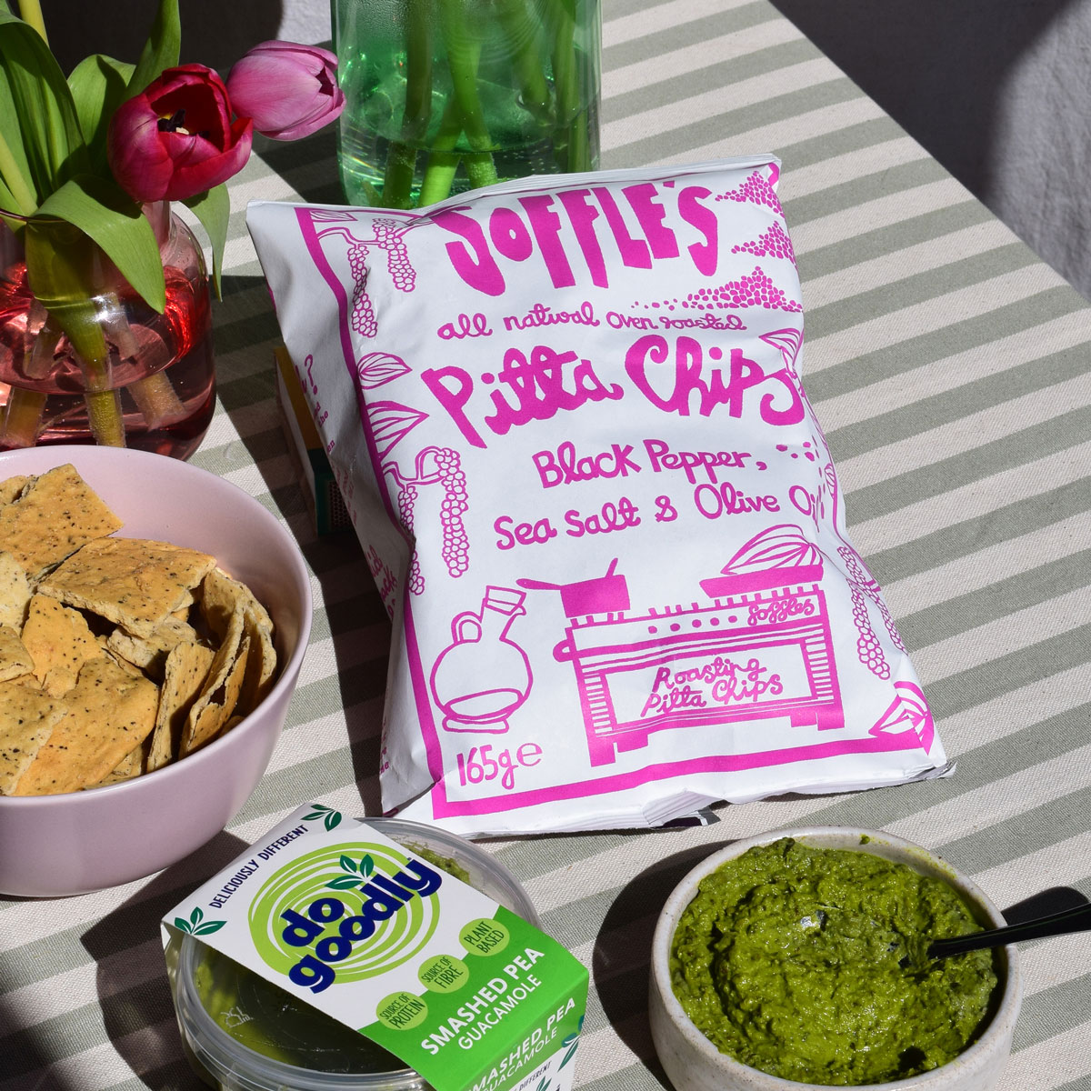 A bowl of crisps with dip