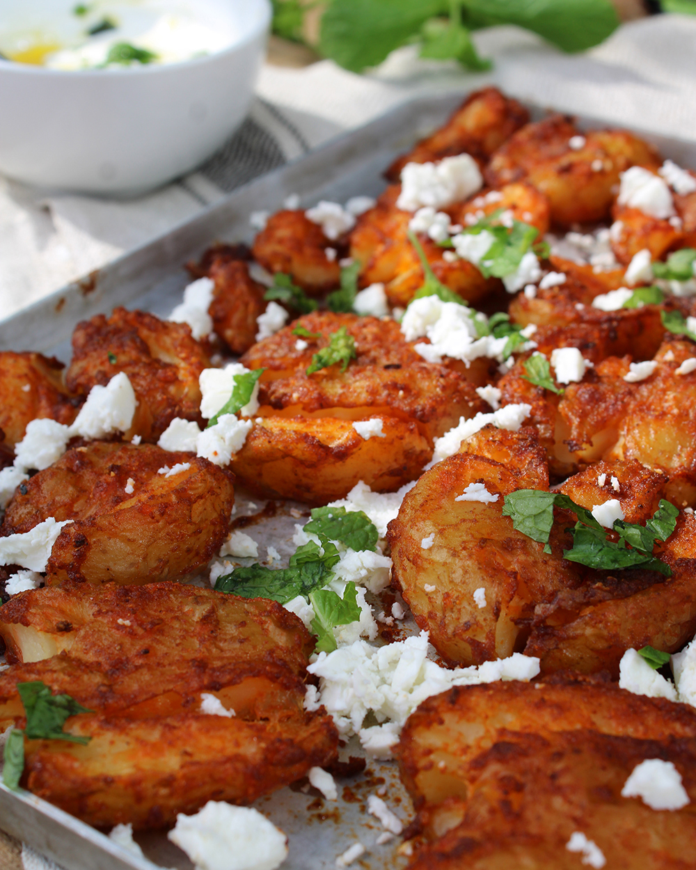 SPICY SMASHED POTATOES WITH FETA DIP